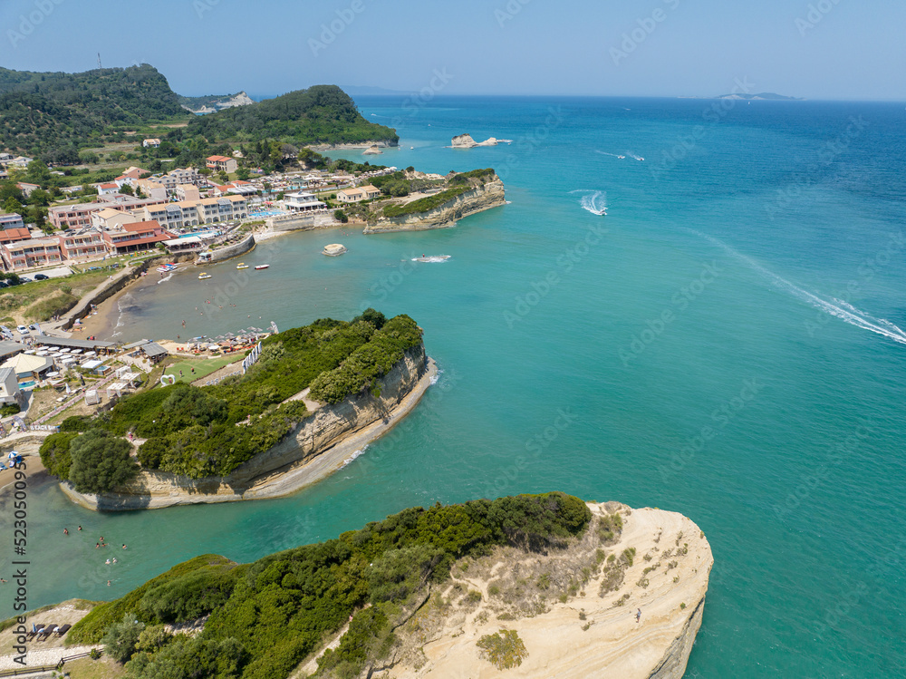 Aerial view of the promontory of Sidari in the northern part of the island of Corfu, Greece. Canal D'Amour cliffs. Bathers on the rocks and in the water
