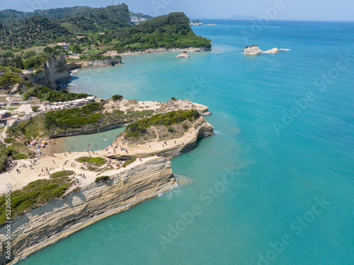 Aerial view of the promontory of Sidari in the northern part of the island of Corfu, Greece. Canal D'Amour cliffs. Bathers on the rocks and in the water
