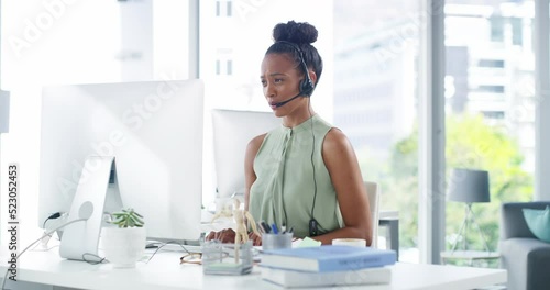 Call center agent answering and talking online, consulting via video call in an office. Female customer service rep talking to a client, assisting and offering online support or customer care photo