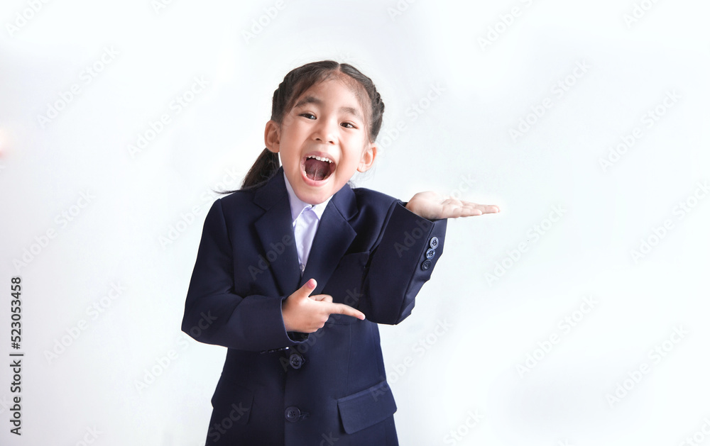 happy asian kids wearing school suit showing open hand as welcome isolated happy asian kids wearing school suit showing open hand as welcome isolated