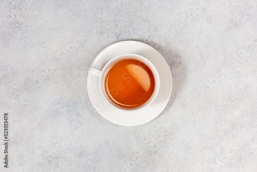 Cup of tea on white background. Top view. Copy space.