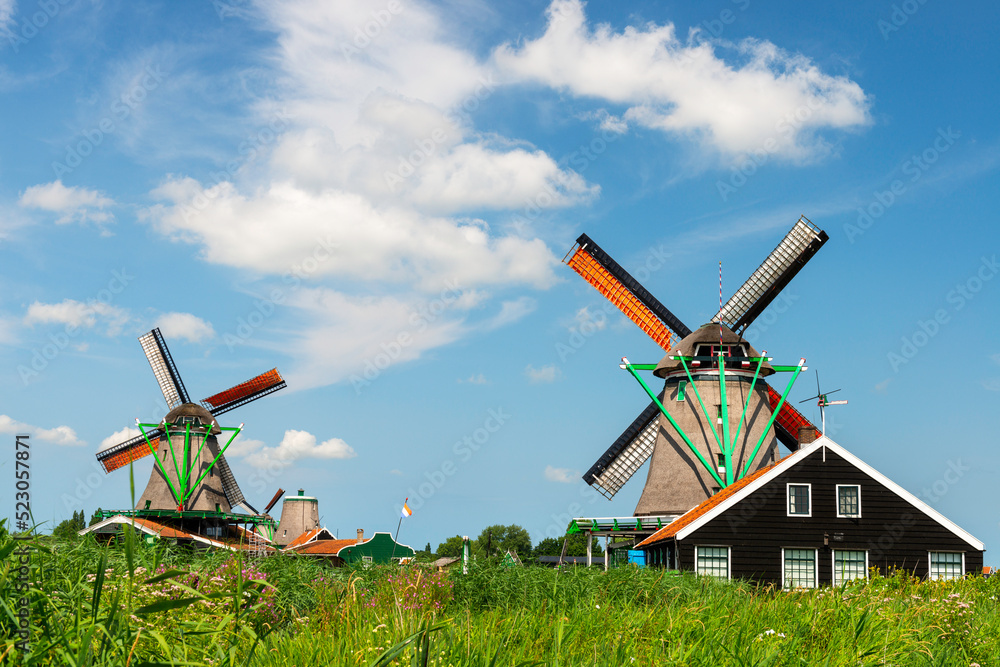 Naklejka premium Windmills in Zaanse Schans, traditional village in Holland.