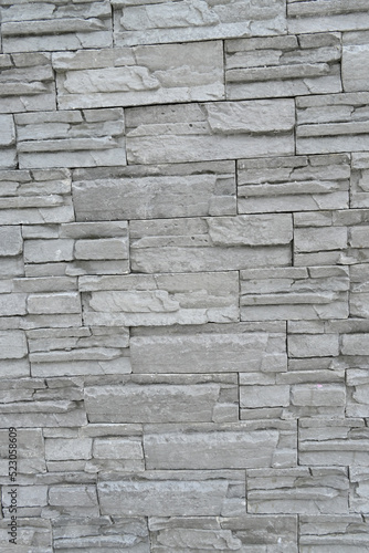 closeup the bunch grey brown stone wall soft focus natural grey brown background.