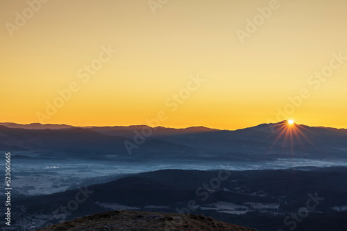 First Rays of Sunlight in Winter Morning over Land Around Postojna Slovenia