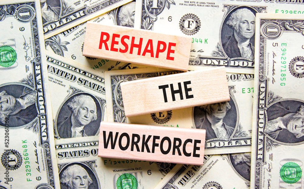 Reshape the workforce and support symbol. Concept words Reshape the workforce on wooden blocks. Beautiful background from dollar bills. Business reshape the workforce quote concept. Copy space