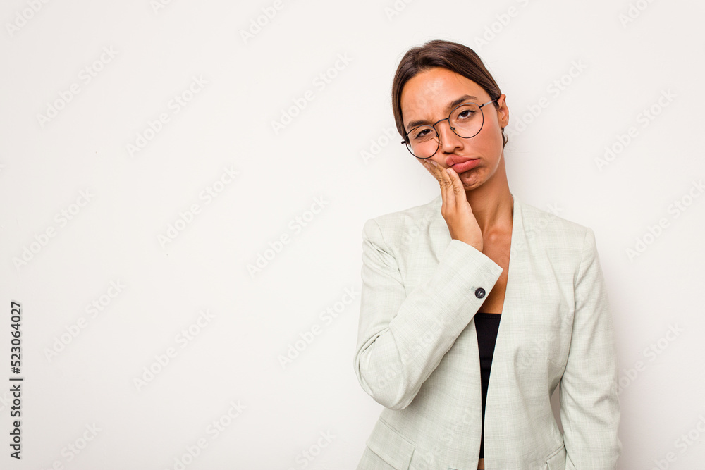 Young hispanic woman isolated on white background who feels sad and pensive, looking at copy space. Young hispanic woman isolated on white background who feels sad and pensive, looking at copy space.