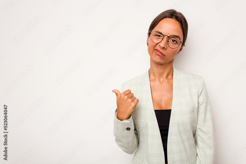 Young hispanic woman isolated on white background shocked pointing with index fingers to a copy space. Young hispanic woman isolated on white background shocked pointing with index fingers to a copy space.
