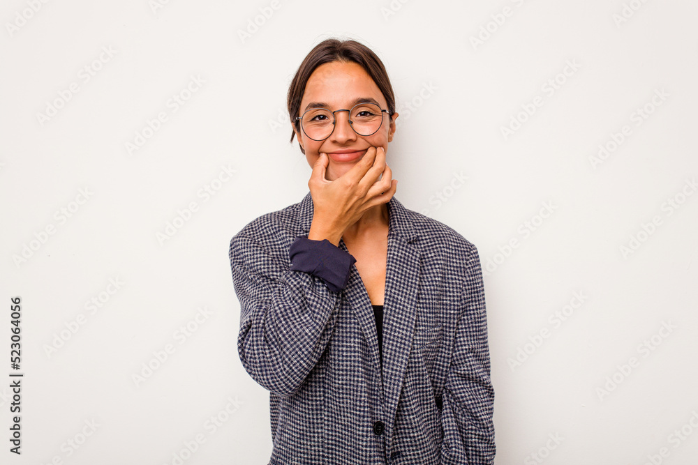 Young hispanic woman isolated on white background doubting between two options. Young hispanic woman isolated on white background doubting between two options.