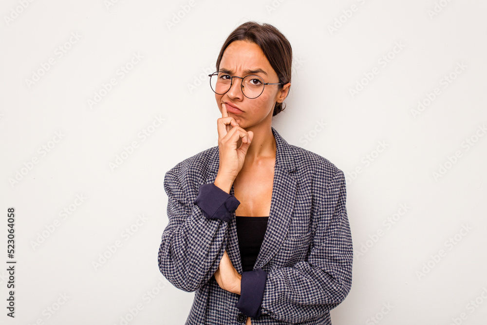 Young hispanic woman isolated on white background unhappy looking in camera with sarcastic expression. Young hispanic woman isolated on white background unhappy looking in camera with sarcastic expression.