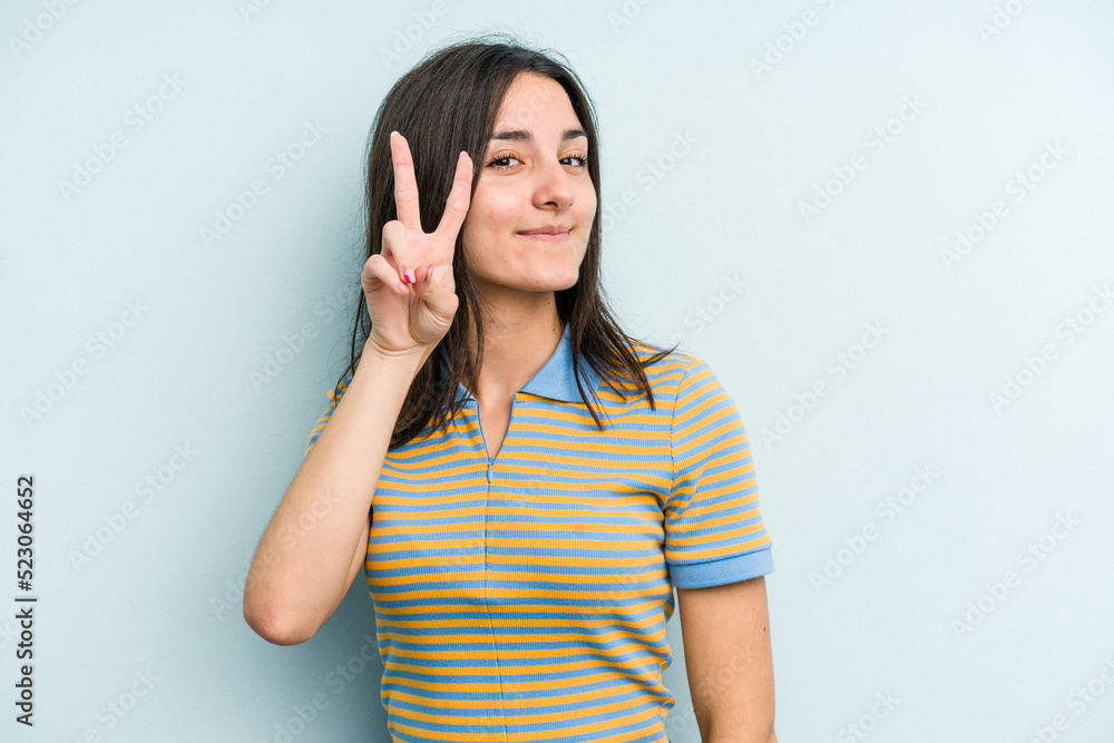 Young caucasian woman isolated on blue background showing number two with fingers. Young caucasian woman isolated on blue background showing number two with fingers.