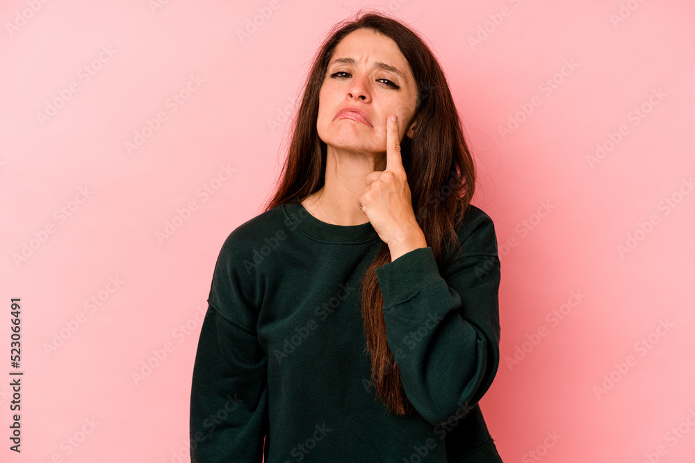 Young caucasian woman isolated on pink background crying, unhappy with something, agony and confusion concept. Young caucasian woman isolated on pink background crying, unhappy with something, agony and confusion concept.