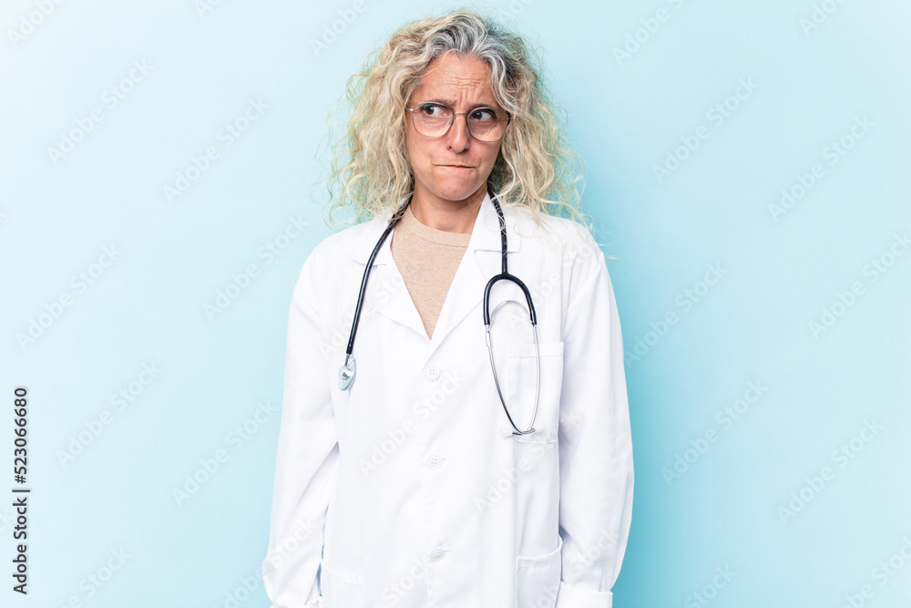 Middle age caucasian woman isolated on blue background confused, feels doubtful and unsure. Middle age caucasian woman isolated on blue background confused, feels doubtful and unsure.