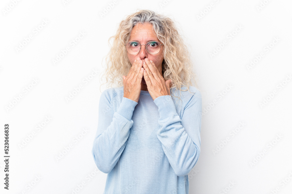 Middle age caucasian woman isolated on white background shocked covering mouth with hands. Middle age caucasian woman isolated on white background shocked covering mouth with hands.