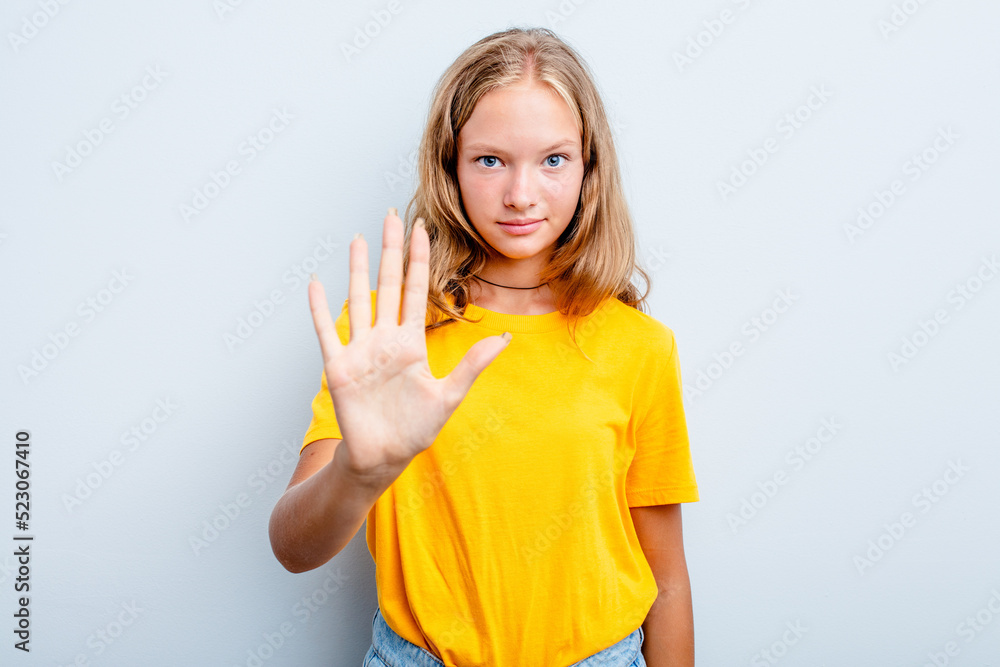 Caucasian teen girl isolated on blue background smiling cheerful showing number five with fingers. Caucasian teen girl isolated on blue background smiling cheerful showing number five with fingers.