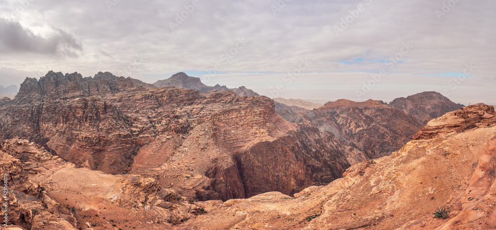 View to rocky landscape from viewpoint near Ad Deir (The Monastery) in Petra, Jordan