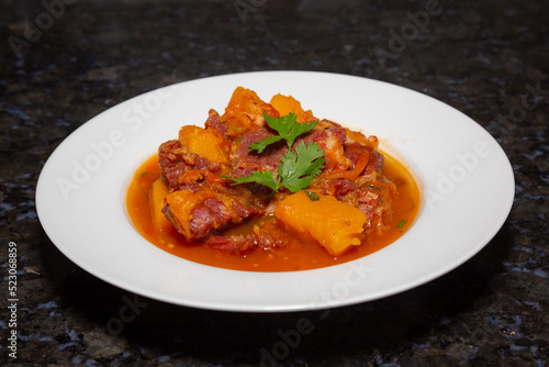 Fototapeta Naklejka Na Ścianę i Meble -  Dry meat with pumpkin, traditional Brazilian rustic dish. On the white plate