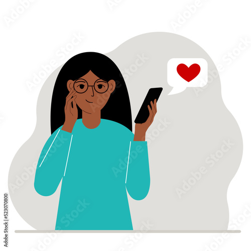 Satisfied woman reads a message on his mobile phone. Message with red heart. Vector