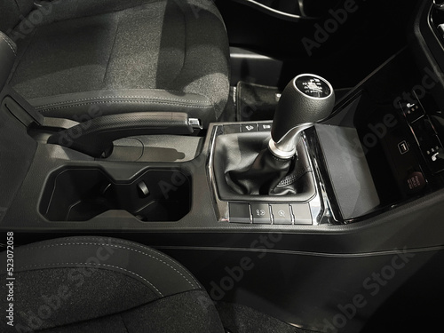 The interior of a new car with a black interior. Manual transmission in leather trim