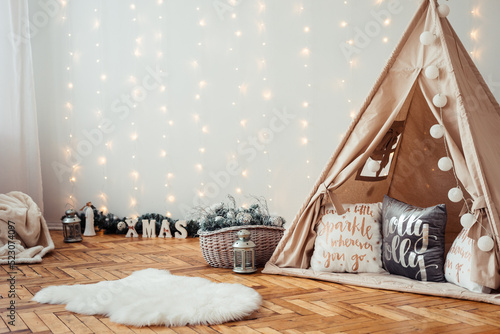 Children's Christmas Location. Beige Wigwam Decorated. Photo Zone for children in Rustic Style.