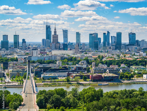 Swietokrzyski bridge and skyscrapers in city center, Warsaw aerial landscape under blue sky