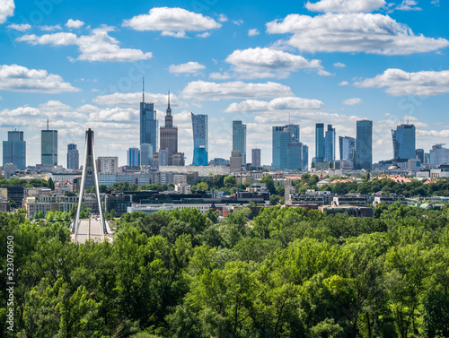 Swietokrzyski bridge and skyscrapers in city center, Warsaw aerial landscape under blue sky