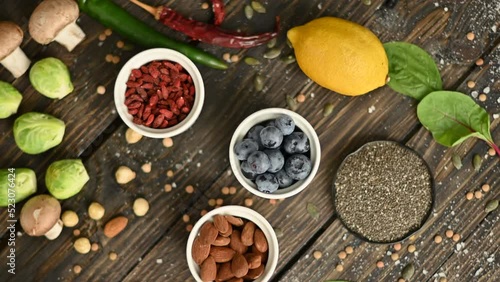 Wallpaper Mural Food composition with fruits and vegetables, blueberries, goji berries, lemon, almonds, chia seeds, beans Torontodigital.ca