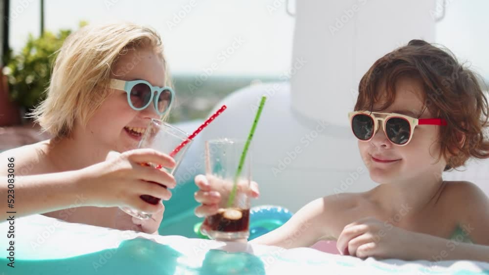 kids chilling in the inflatable pool at rooftop patio kids chilling in the inflatable pool at rooftop patio