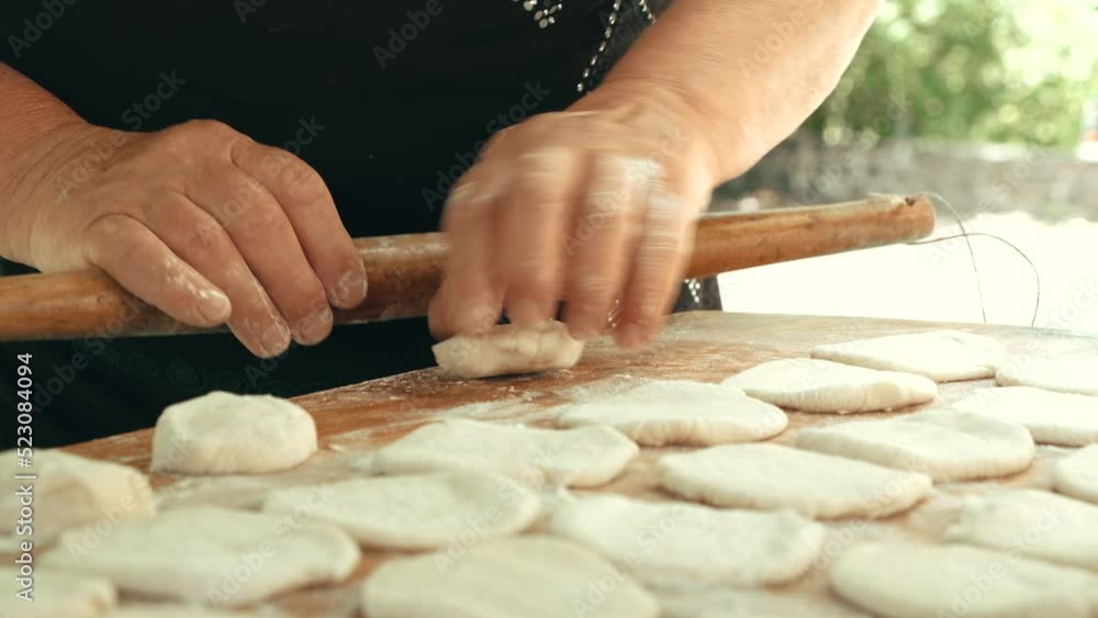 hands mold homemade dumplings from dough. grandma cooks homemade food hands mold homemade dumplings from dough. grandma cooks homemade food