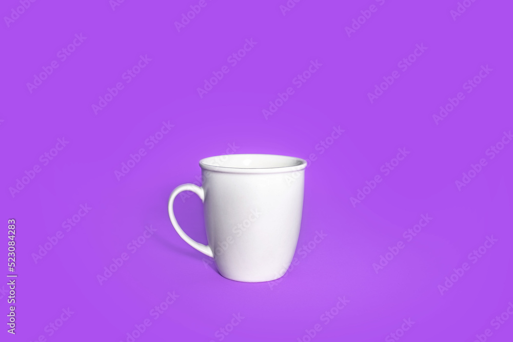 White empty coffee mug, cup of coffee, on a lilac background. White empty coffee mug, cup of coffee, on a lilac background.