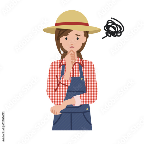 立って手をあごにあてて困っている農家の女性