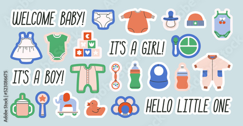 Big set of stickers with clothes, toys and products for newborn babies. Includes phrases and illustrations. Baby Shower or Birthday concept. Cute vector illustrations isolated on blue background.