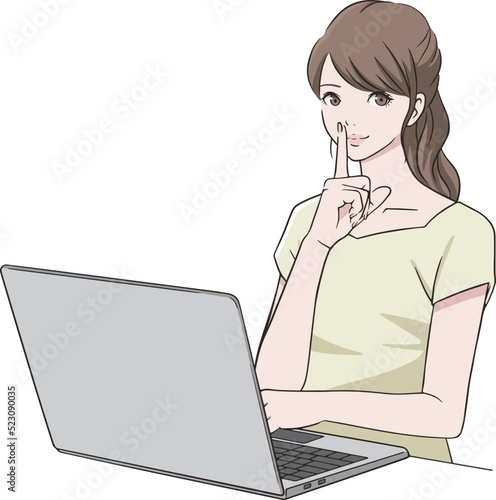 PC前で人差し指を口に当てる女性
