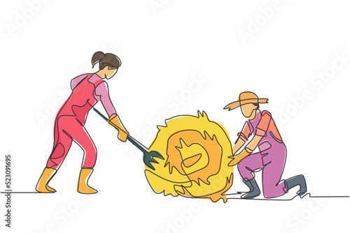Single one line drawing female farmer was stabbing a haystack and rolling it with straw stick and the male farmer was helping her. Minimalism concept. One line draw design graphic vector illustration.