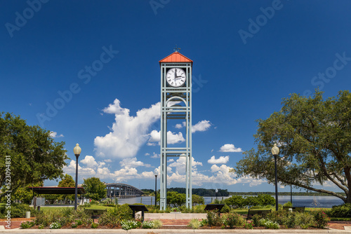 Photo of the clock tower at Riverfront Park in Palatka along the St John's River in Florida on a beautiful sunny day photo