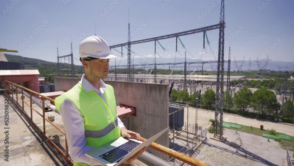 Power generation plant.
Engineer working with his laptop at the power plant.
Power generation plant.
Engineer working with his laptop at the power plant.