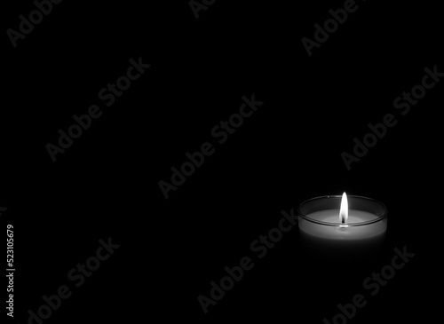 Fotografie The concept of mourn, Candle dark on black background, RIP; grief or sorrow