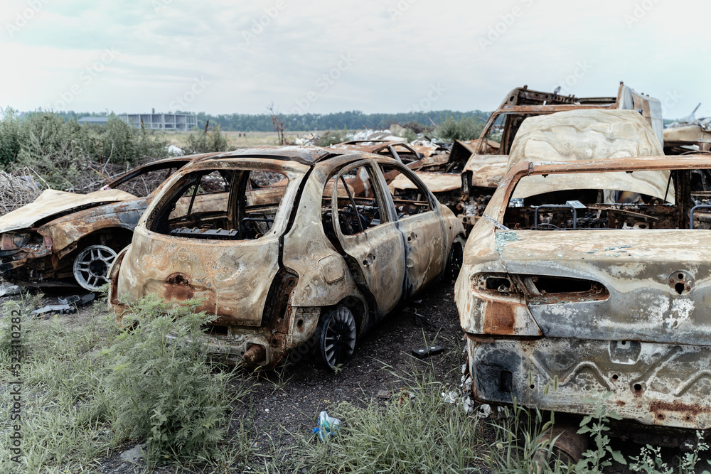 15.07.2022,Bucha Many shot and destroyed cars of civilians gathered in a car graveyard in Irpin. War in Ukraine, russian military crimes 15.07.2022,Bucha Many shot and destroyed cars of civilians gathered in a car graveyard in Irpin. War in Ukraine, russian military crimes