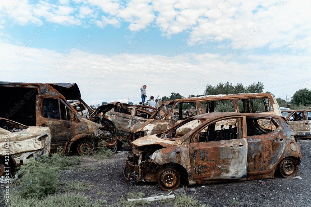 Obraz premium 15.07.2022,Bucha Car graveyard. Shot cars of civilians. russia's war against Ukraine