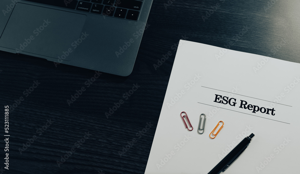 There is a dummy document of ESG Report on the desk. There is a dummy document of ESG Report on the desk.