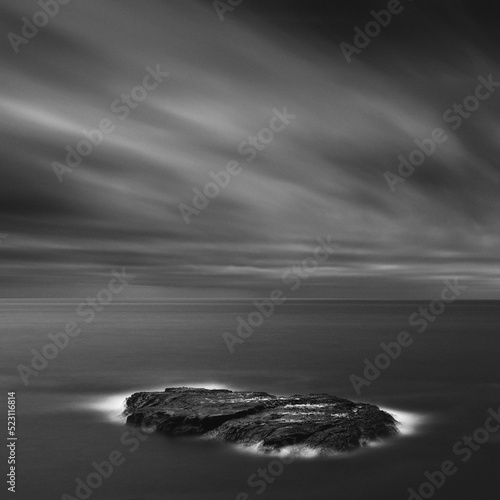Dramatic long exposure shot of sea rocks waves and cloudy sky, Kanagawa Prefecture, Japan