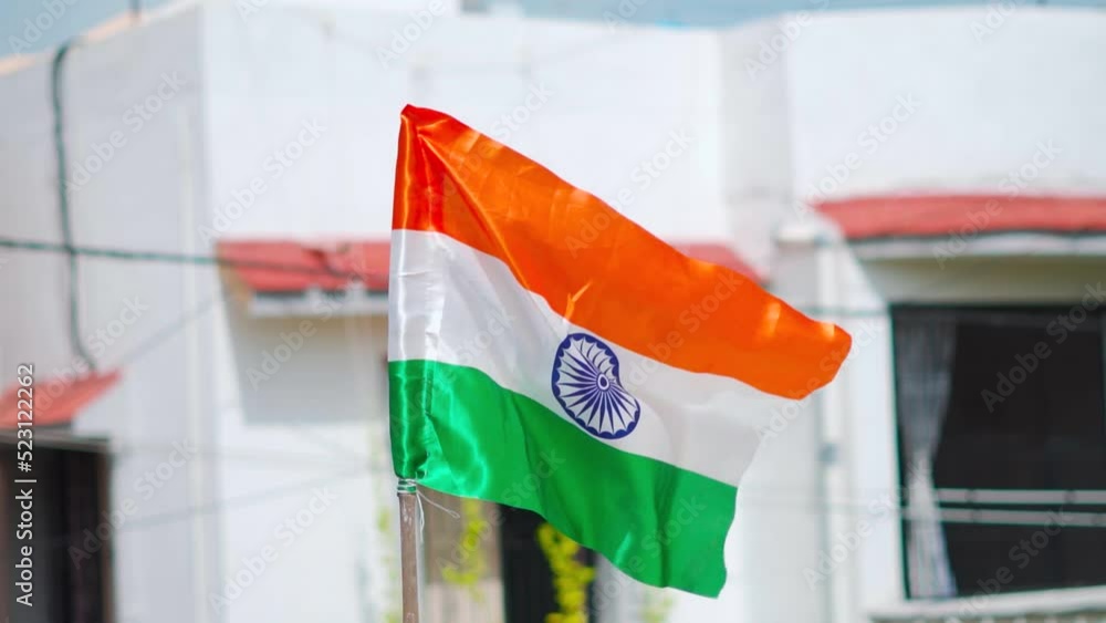 India flag. Indian flag displaying on a pole in front of the house ...