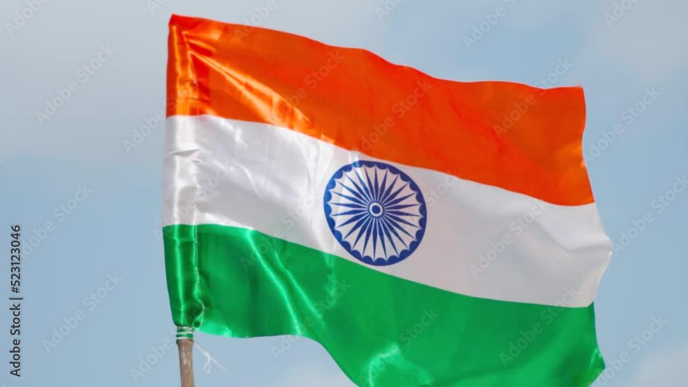 Tricolor Indian Flag Fluttering in background of blue sky at Bhuj ...