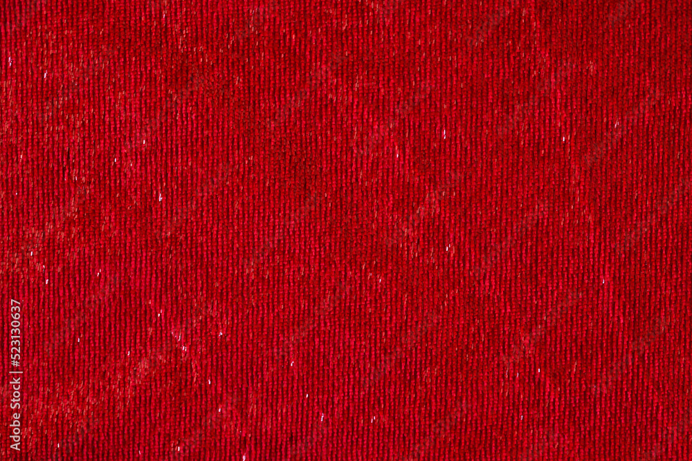 Dark red smooth textile material with shiny thread textured background