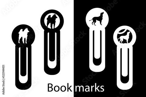 A designer bookmark with a carved dog silhouette. Office tools. Paper cut. Laser cutting.