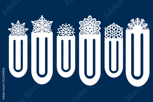 Paperclip bookmarks with cut-out snowflake decoration. Laser cutting. Paper cut