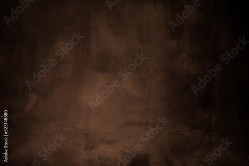 Dark brown painted background with black shadows on both sides photo