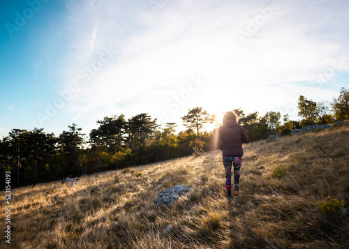 girl walking in nature © zhukovvvlad