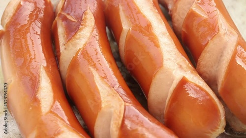 frying sausage in fry pan, close up shot