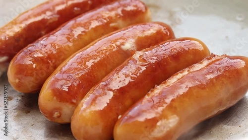 frying cheese sausage in fry pan , close up shot