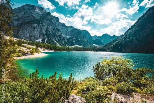 Beautiful view on turquoise Baires Lake in the Dolomite mountains in the afternoon. Braies Lake (Pragser Wildsee, Lago di Braies), Dolomites, South Tirol, Italy, Europe. photo